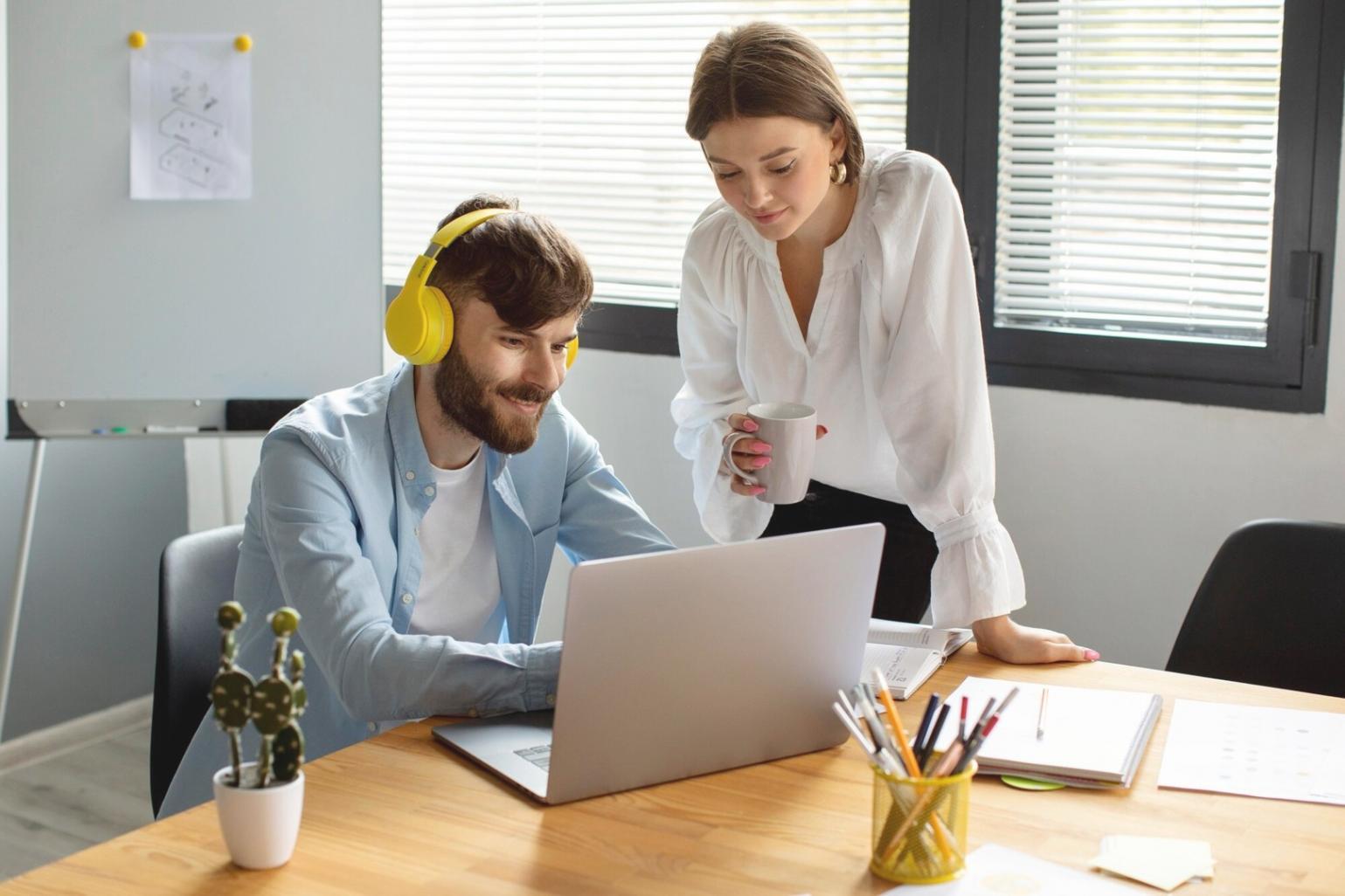 Professional reviewing expense tracking spreadsheet with financial documents